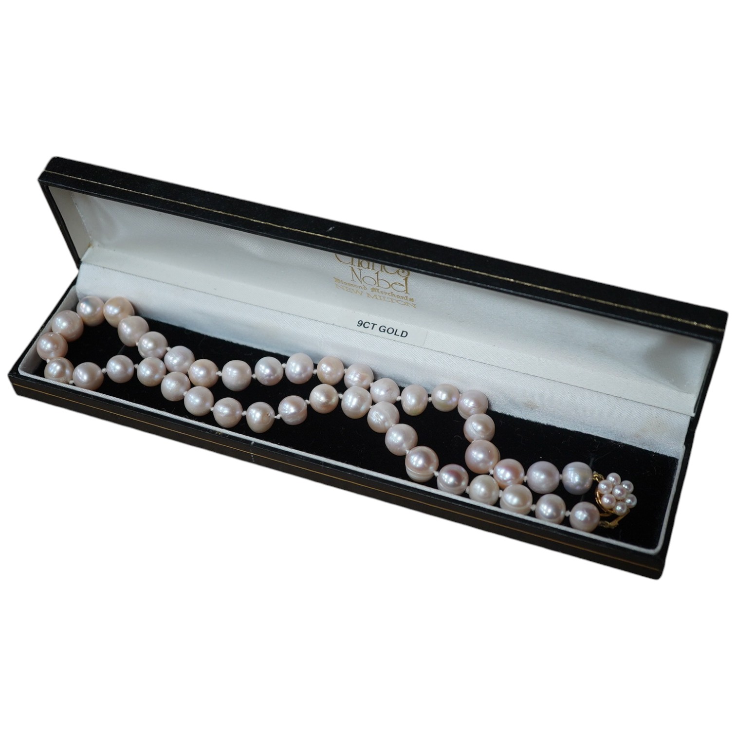 A modern single strand cultured pearl necklace, with cultured pearl cluster set 9ct clasp. Condition - fair to good